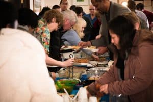 The Congregation Enjoys an Oneg Shabbat Meal